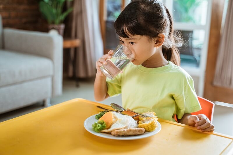 Young girl eating a meal